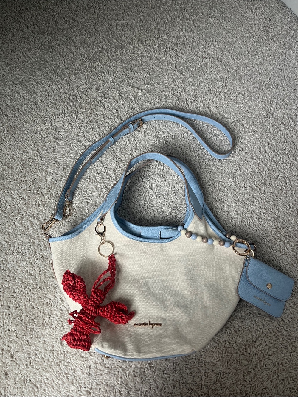 Anthropologie Cream Tote with Light Blue Trim and Red Crochet Charm